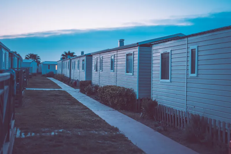 Row of manufactured homes with skirting closing in the crawlspace
