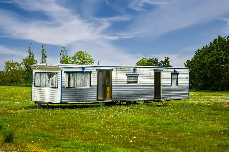 Mobile home on its lot, anchored with tie-downs